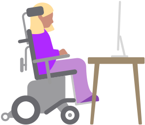Una persona en una silla de ruedas motorizada mira un computador Mac ubicado en un escritorio