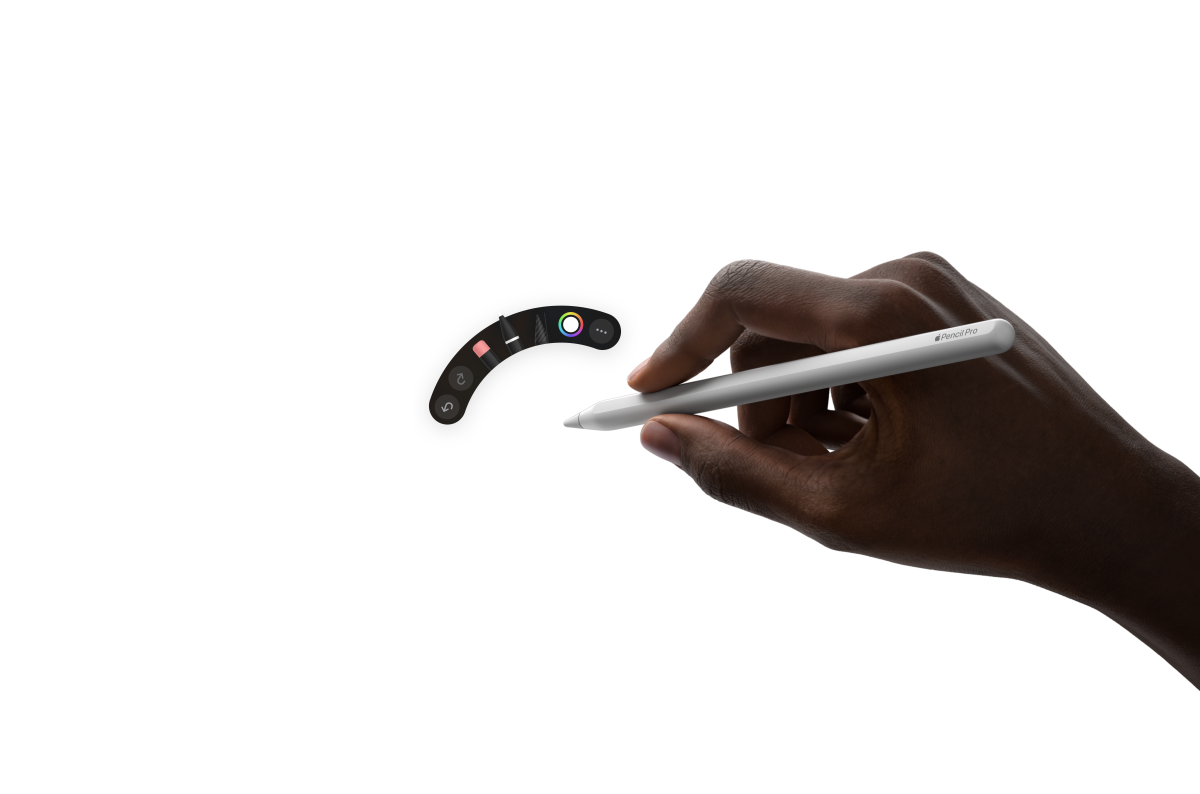 iPad Air, face avant, une main tenant un Apple Pencil Pro travaille sur une illustration accompagnée de notes manuscrites dans Procreate