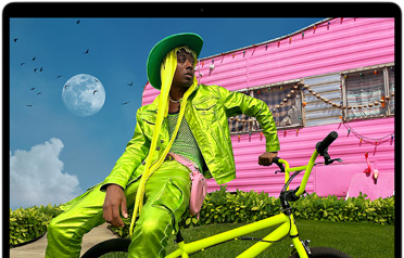 MacBook Air screen showing photo of person in colourful outfit, demonstrating colour range and resolution of Liquid Retina display