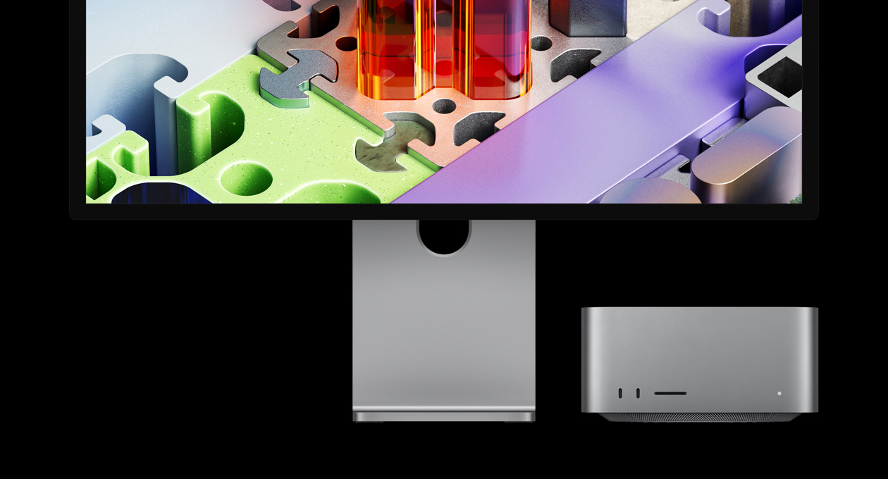 Mac Studio dipasangkan dengan Studio Display XDR, perangkat terselip di bawah layar: Studio Display XDR memiliki wallpaper seperti puzzle tiga dimensi